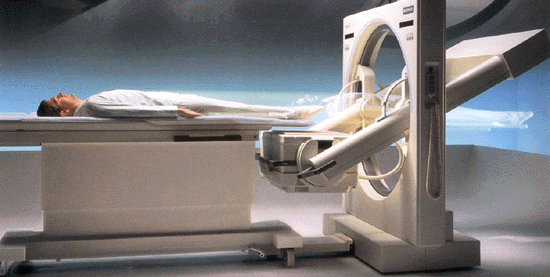 Gamma camera shown with person undergoing exam